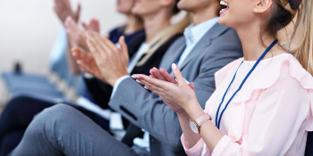hands clapping at a conference
