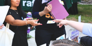 hand giving information to an attendee