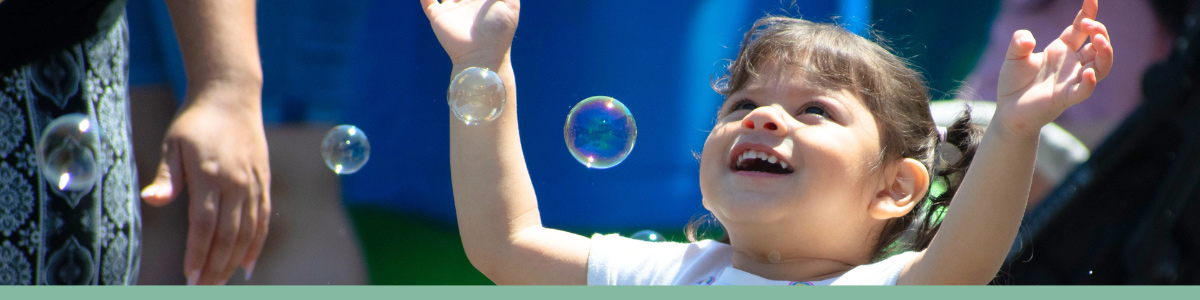 Image of kid playing with bubbles