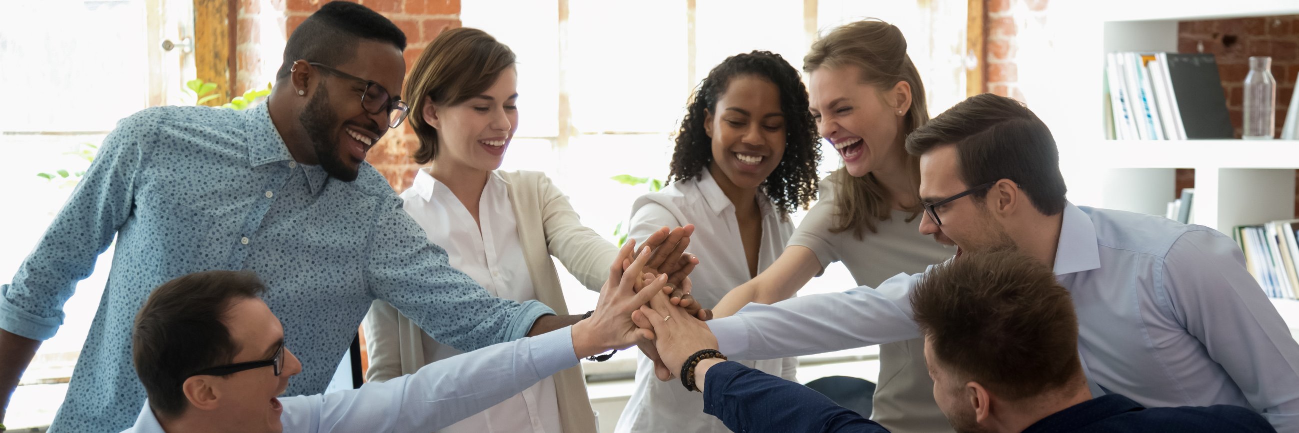 stock-photo-happy-multi-ethnic-colleagues-celebrating-success-giving-high-five-show-support-share