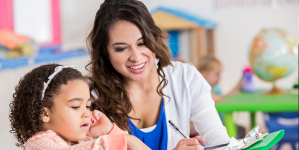 Teacher in calss working with students