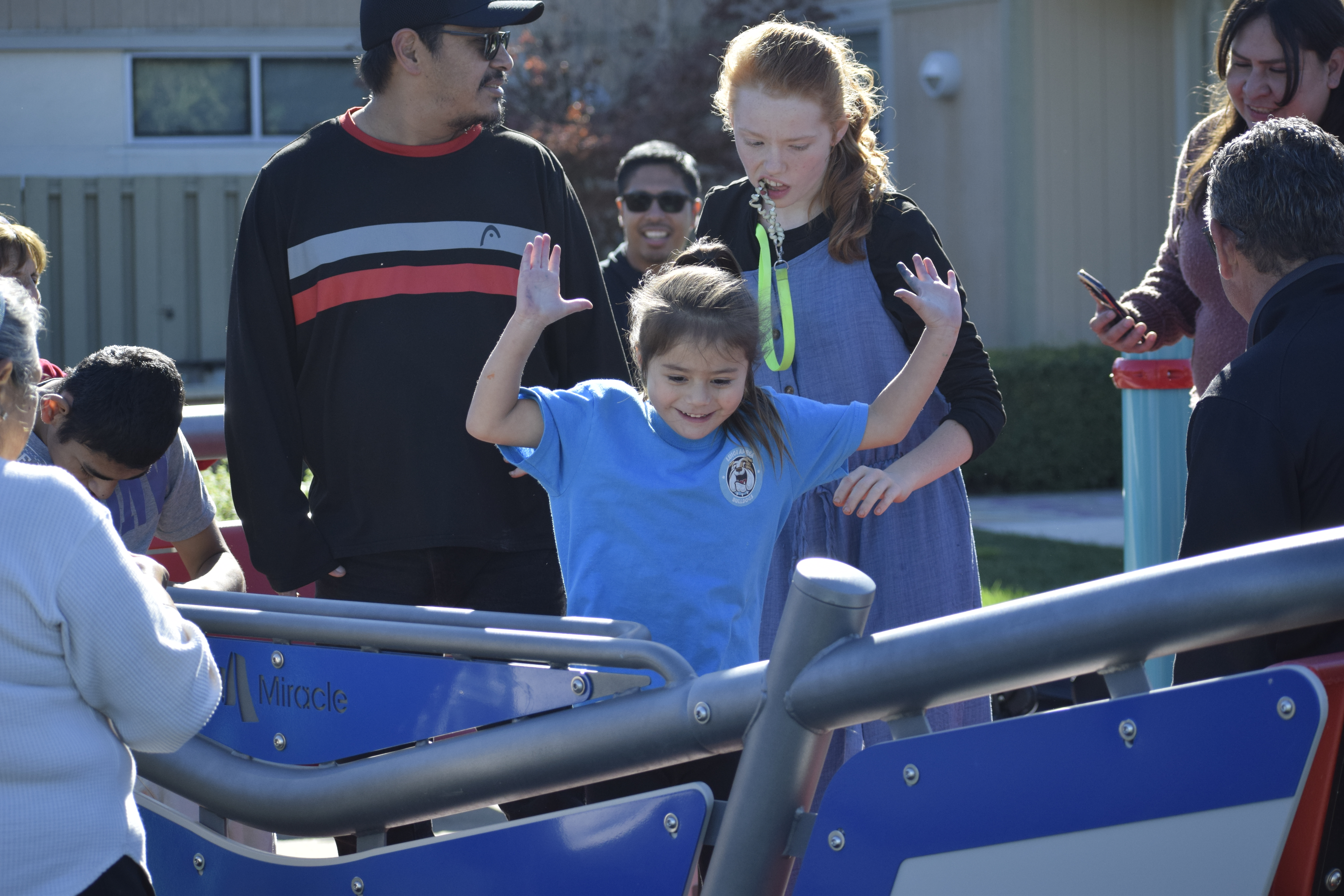 students playing on new inclusive playground