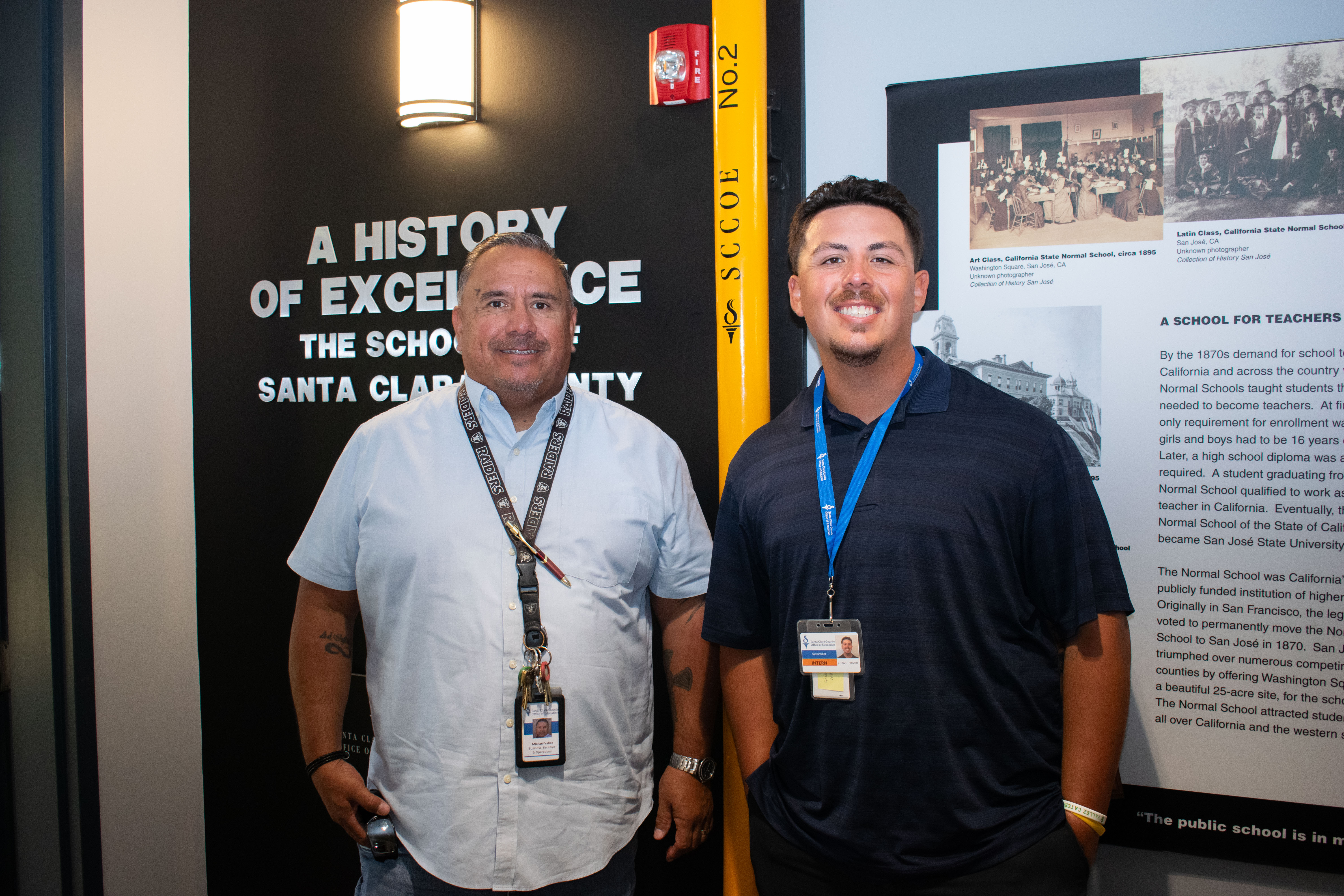 a father and son at the office in a hallway