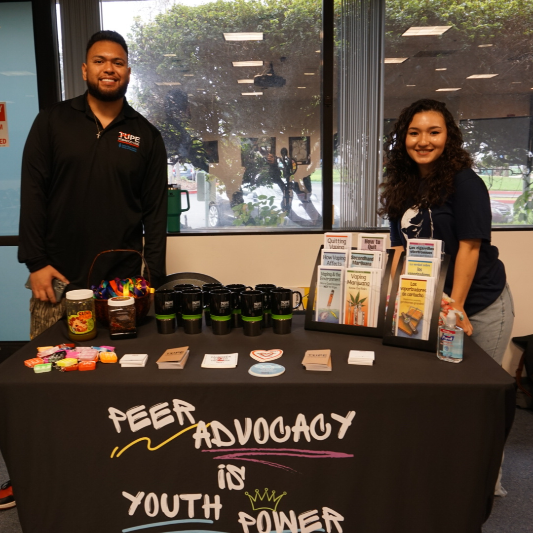 Peer Advocate Advisory Council Table with two youth