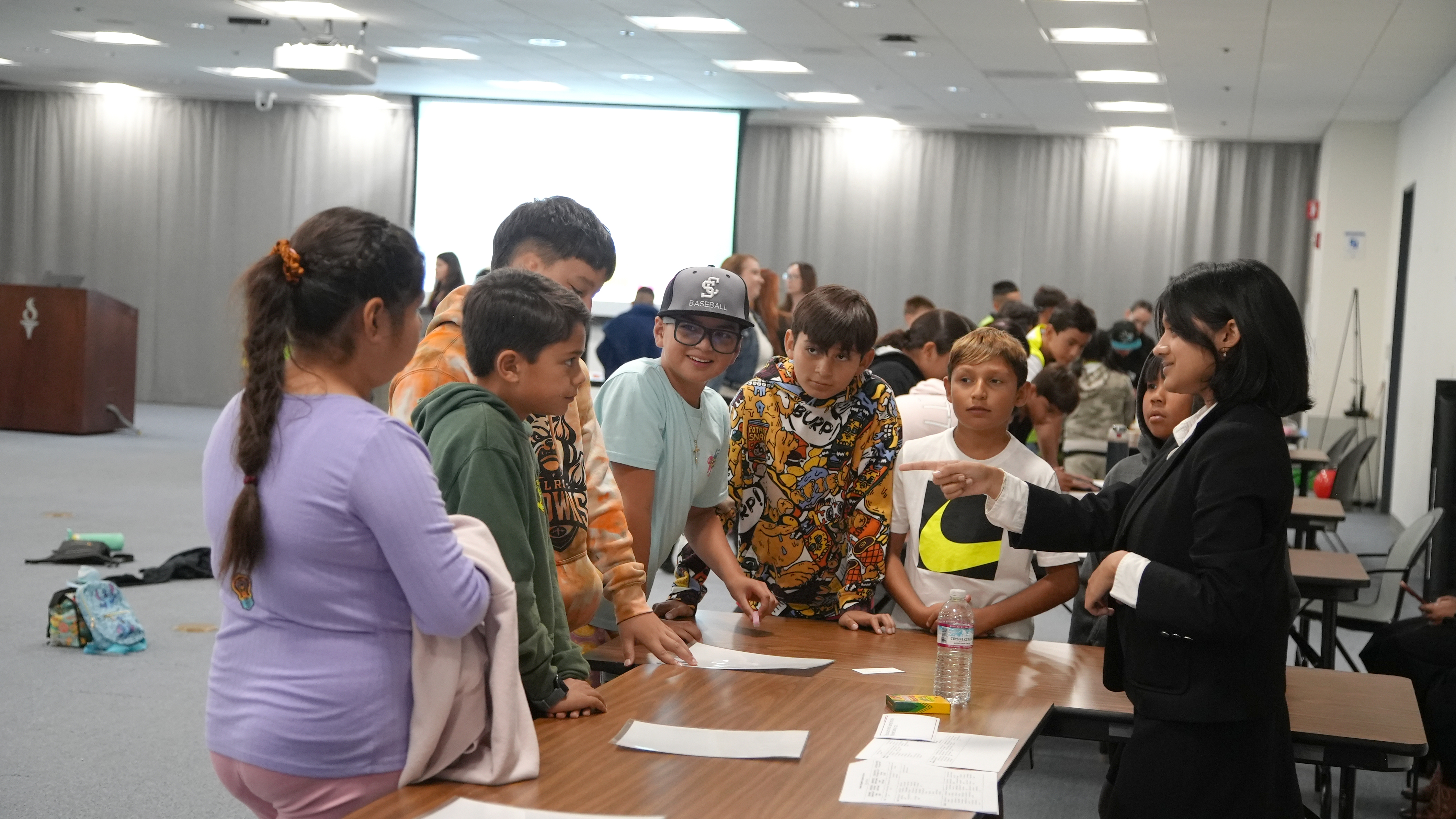 students engaged in hands-on activities led by Lynbrook High School students