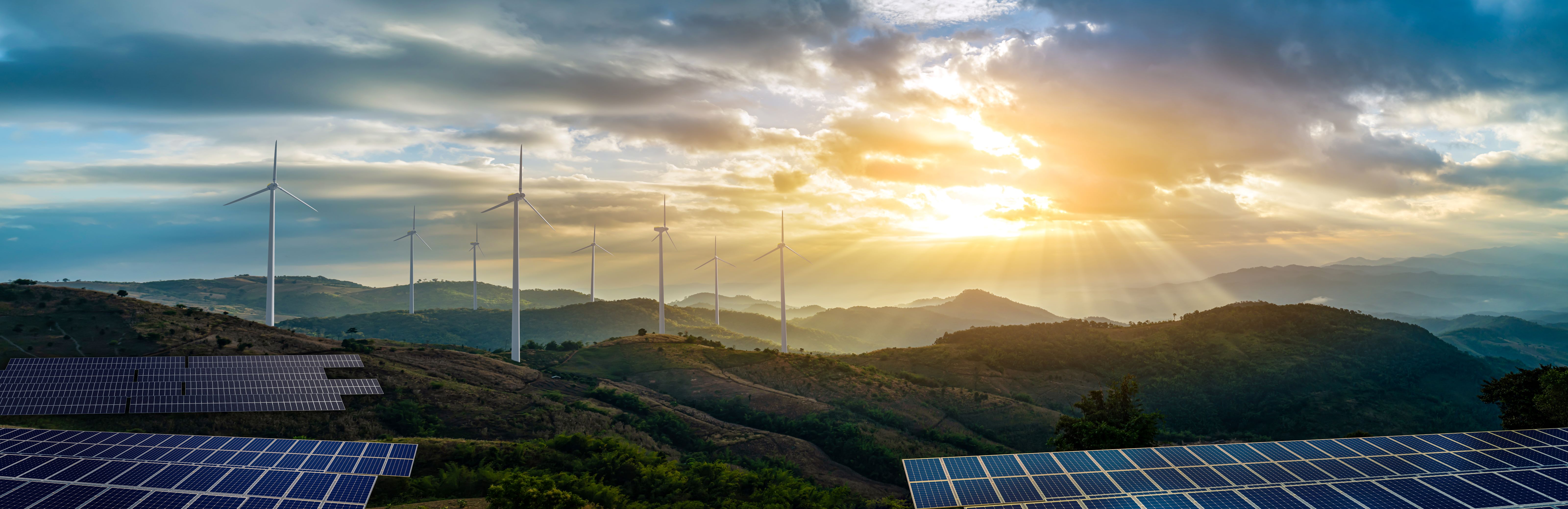 stock-photo-solar-cell-plant-and-wind-generators-under-blue-sky-on-sunset-powerplant-with-photovoltaic-panels-2261372101