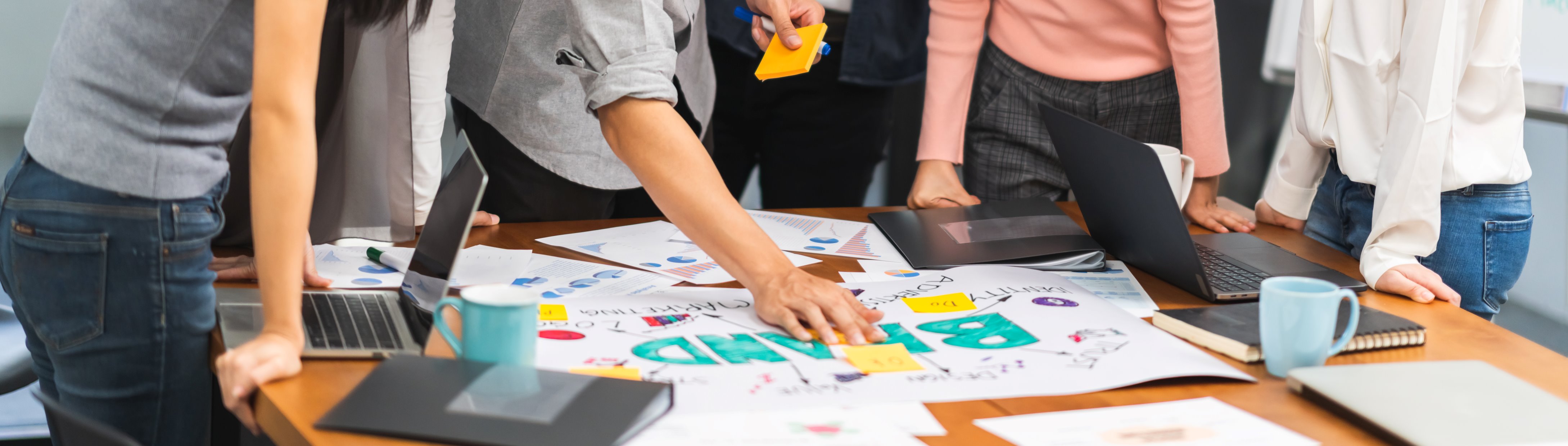 stock-photo-team-members-working-together-and brainstorming