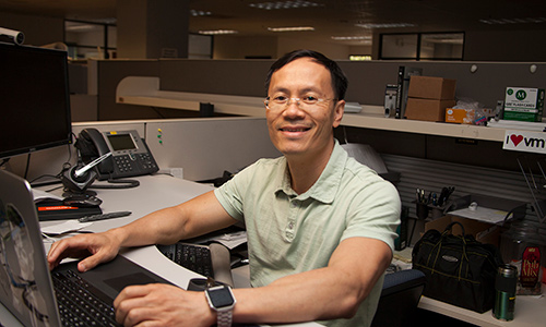 man at an office desk job